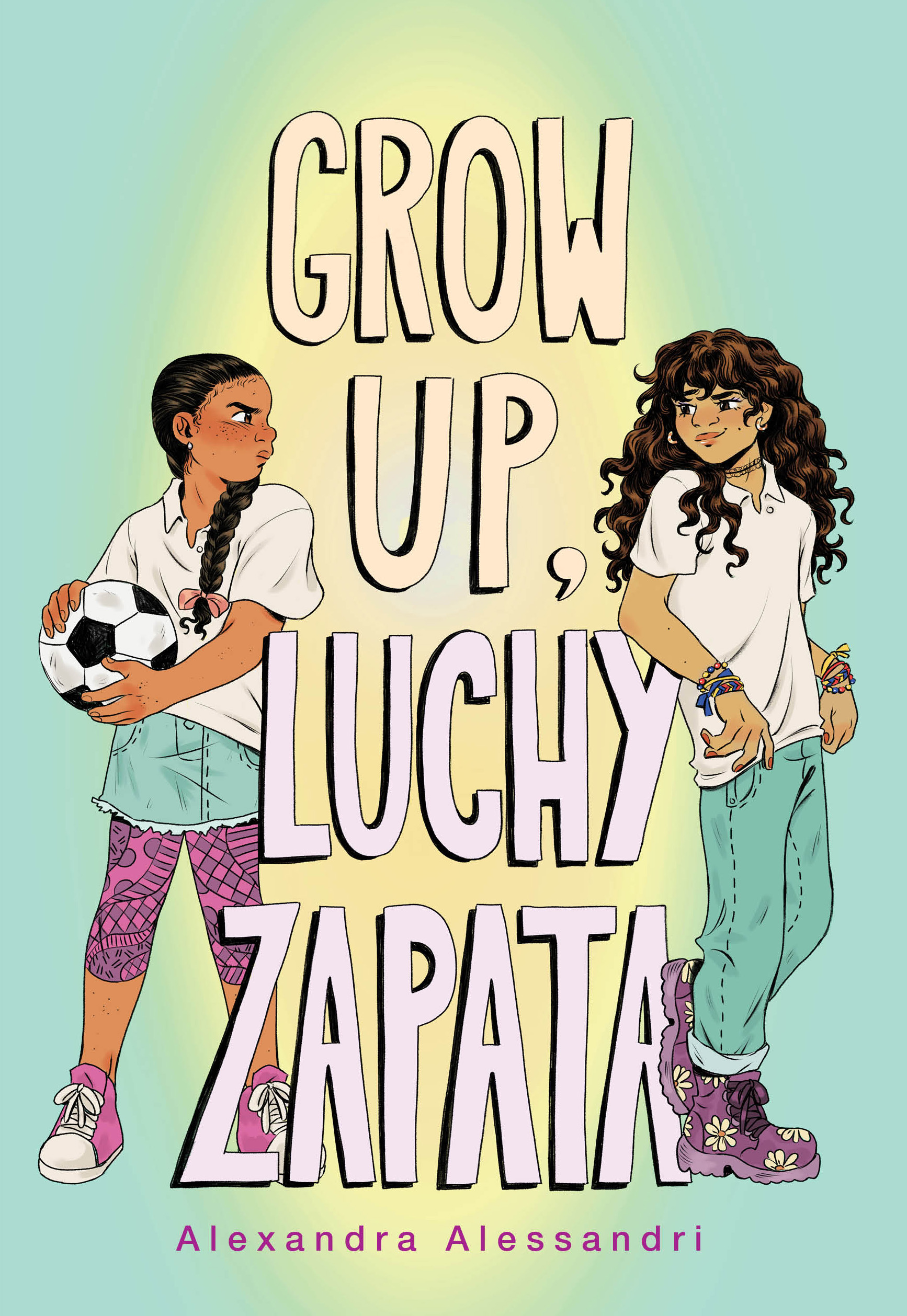 Two girls stand on opposite sides of the words "Grow Up, Luchy Zapata". They are glaring at each other, one is wearing a skirt, polo and leggings while holding a soccer ball, the other is wearing jeans and a polo.
