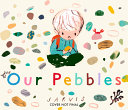 A small boy sits wearing a red backpack and looking at a pebble he holds in his hands. All around him are different colored and shaped pebbles.