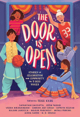 A group of boys and girls standing in an open doorway that looks out to a dark night sky.