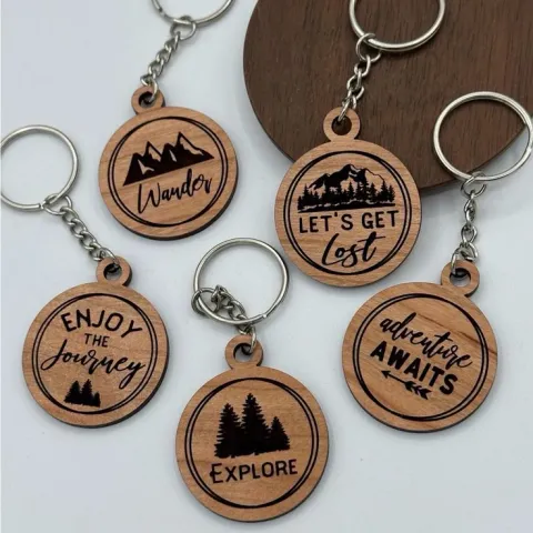 An assortment of wooden keychains made with the Glowforge laser-cutting machine.