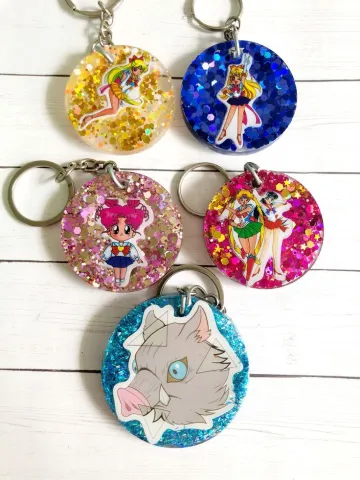 Assortment of colorful keychains featuring anime characters.