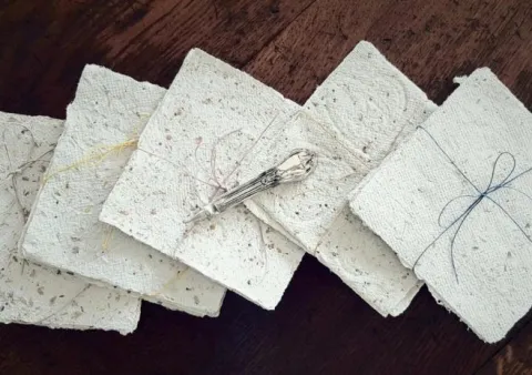 Bundles of handmade paper tied with string