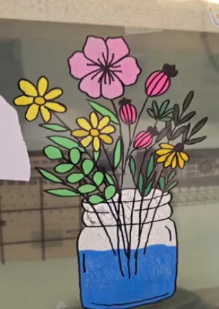 Drawing of flowers in a jar of water on clear plastic