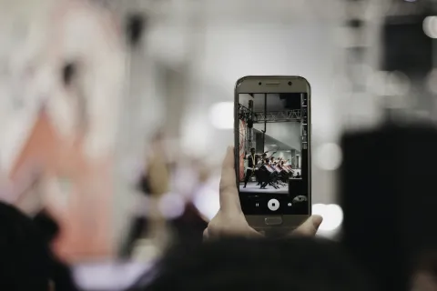 smartphone recording video in crowd