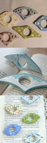 Three examples of clay page holders.