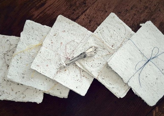 Bundles of handmade paper tied with string