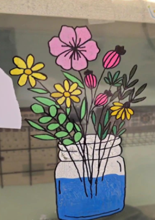 Drawing of flowers in a jar of water on clear plastic