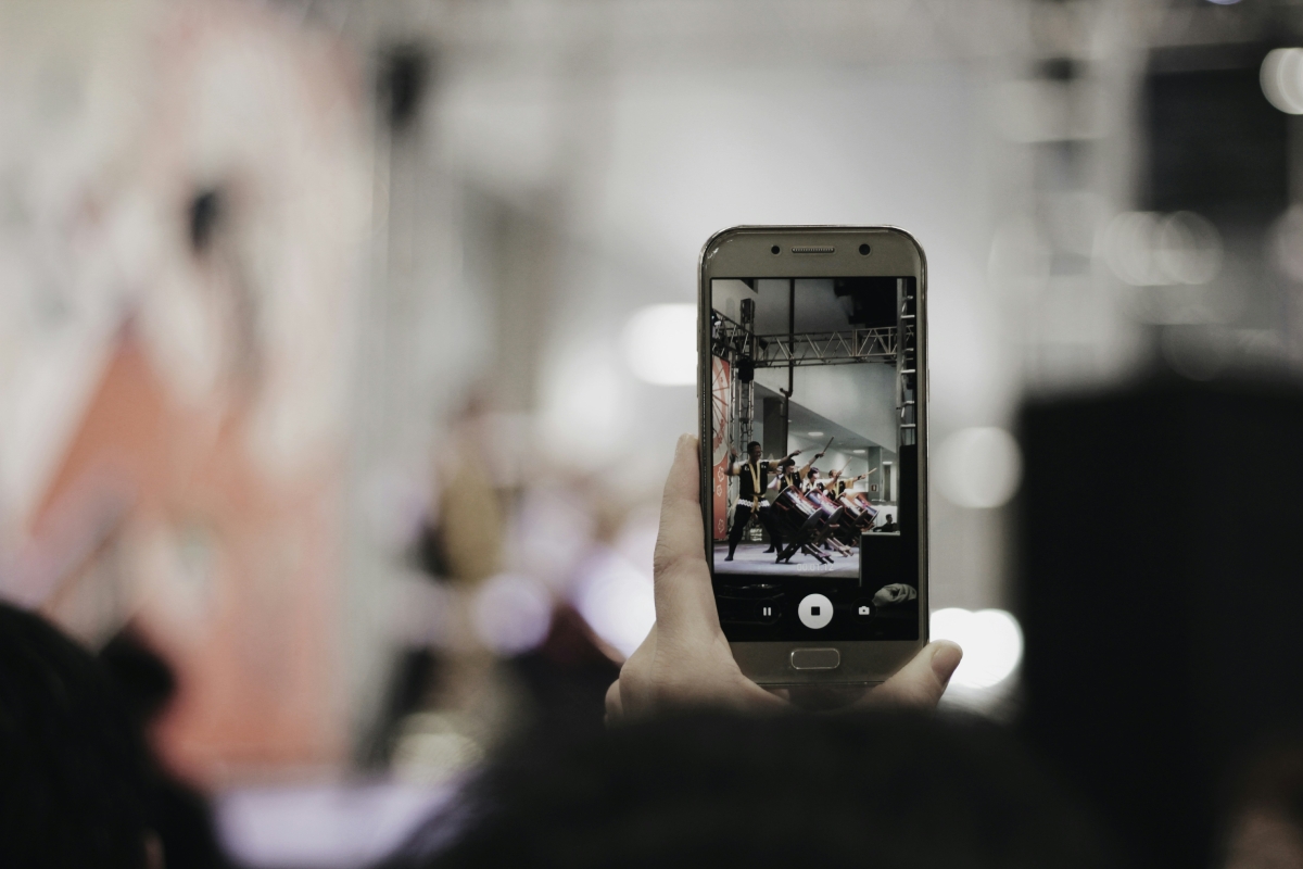 smartphone recording video in crowd