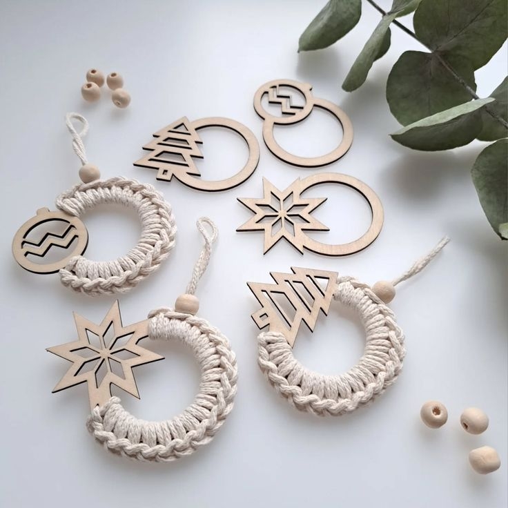 An example of macrame ornaments knotted around a laser cut wooden design.